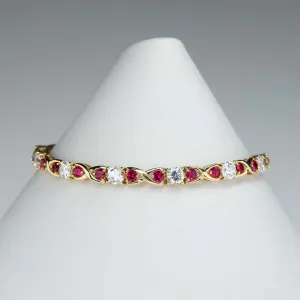 Cubic Zirconia and Red Spinel "X"Link Tennis Bracelet is 14K Yellow Gold